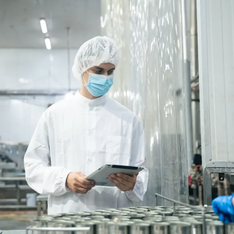 Technician inspectingcarbide heading die precision